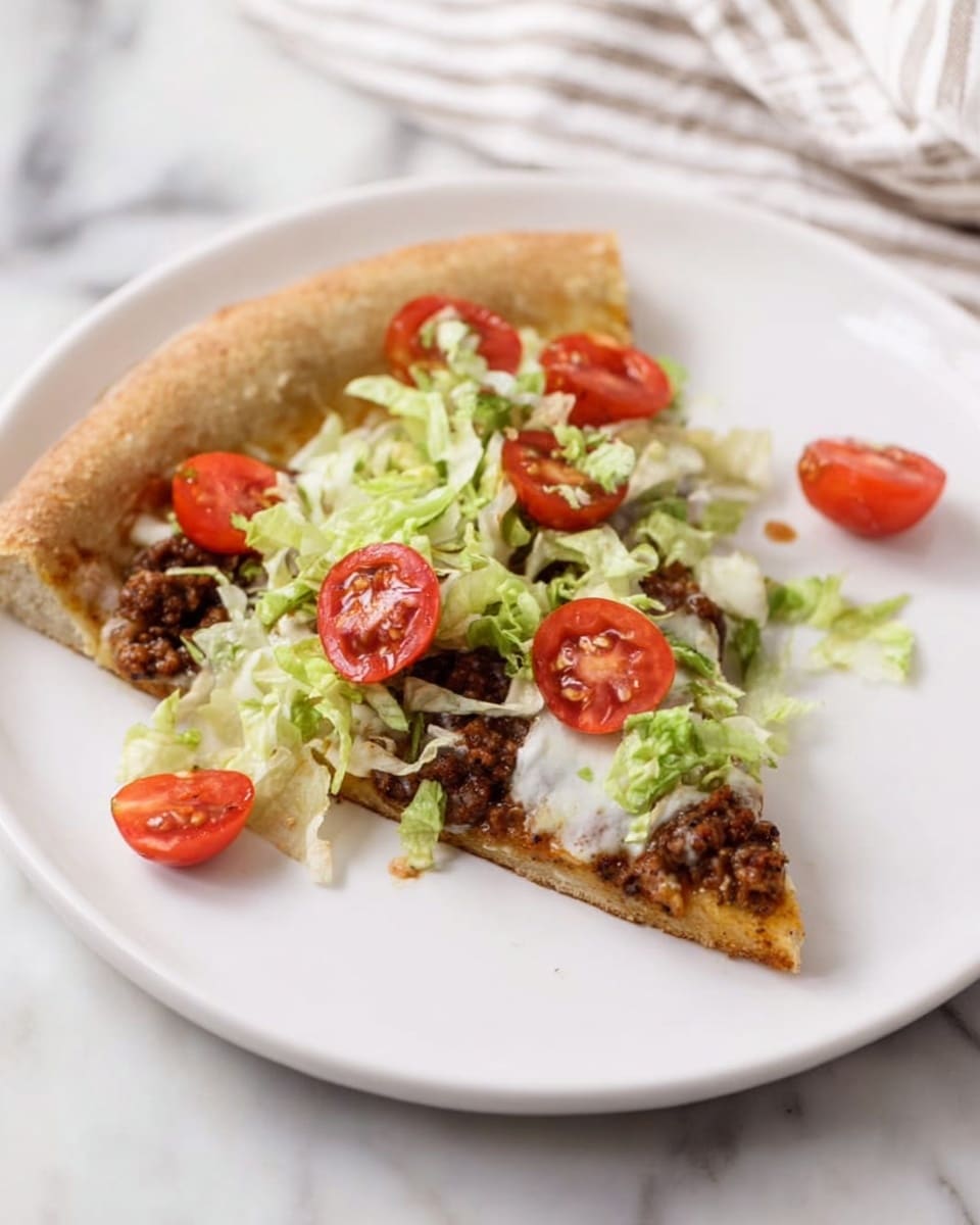 A single slice of pizza lies on a white plate, placed on a white marbled surface with a striped cloth nearby. The pizza has a thick, light brown crust with a soft texture. On top, there is a layer of melted white cheese partially covered by a mix of ground meat that is dark brown and crumbled. Over the meat, there are pieces of shredded green lettuce and halved, bright red cherry tomatoes scattered across the slice. Photo taken with an iphone --ar 4:5 --v 7