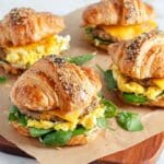 Baked Croissant Breakfast Sandwich with Sausage, Spinach, and Melted Cheese Recipe