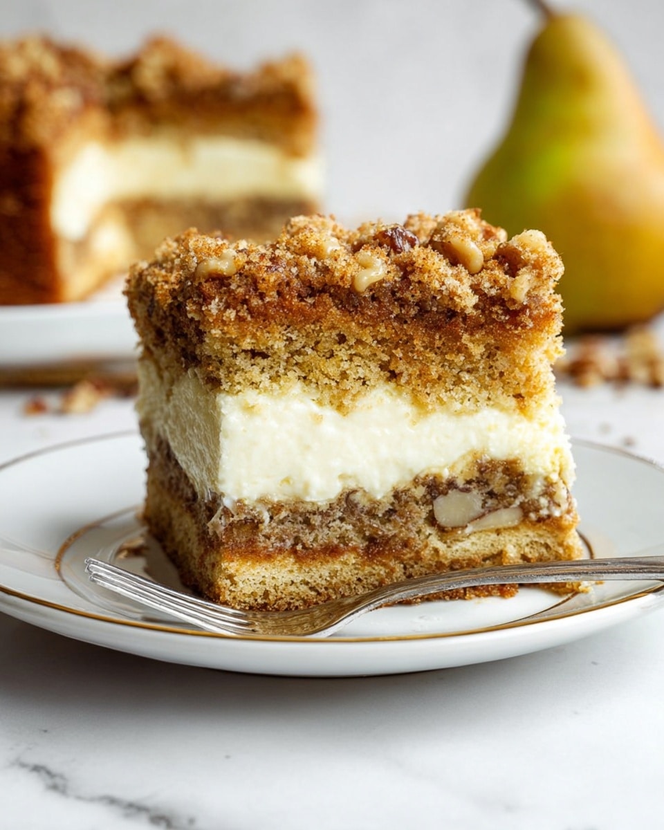 A slice of crumb cake is placed on a white plate with a thin gold rim, resting on a white marbled surface. The cake has three distinct layers: the top is a crumbly, golden-brown streusel with coarse texture and scattered chunks of walnut; the middle layer is creamy and white, contrasting with the crumb topping; and the bottom layer is a moist, light brown cake with visible walnut pieces. There are some crumbs and walnut halves scattered on the plate around the slice. In the blurred background, the rest of the crumb cake loaf is visible, showing the crumbly topping and dense cake inside. The lighting is bright and natural, highlighting the textures and colors. photo taken with an iphone --ar 4:5 --v 7