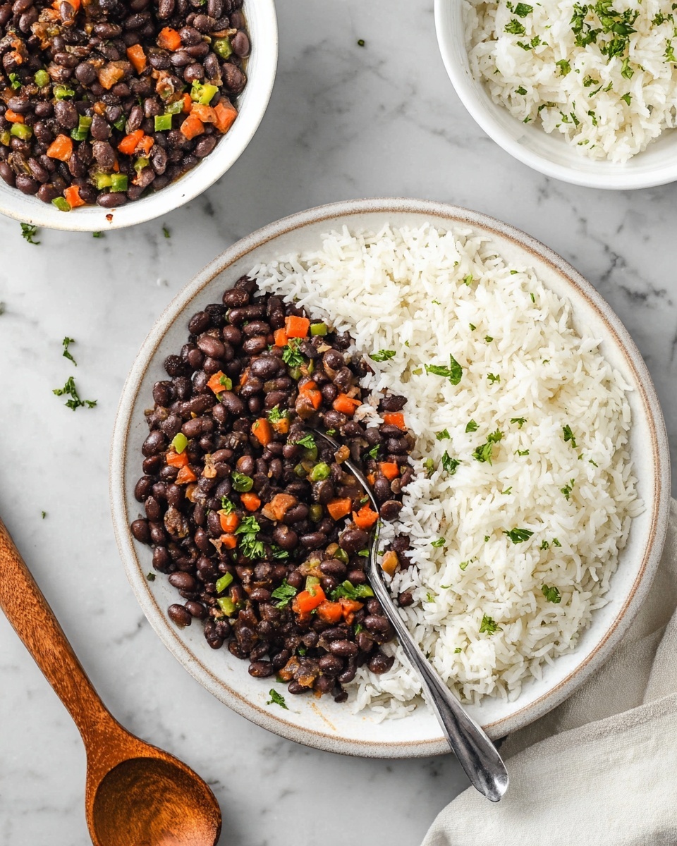 The image shows a round plate with two layers: the outer layer is white rice, fluffy and evenly spread around the edge, and the inner layer is black beans cooked with small pieces of orange carrot and green bell pepper, topped with small green herb leaves. A metal spoon is partially placed in the beans. Around the main plate, there are two white bowls; one filled with plain white rice sprinkled with small green herb leaves and the other with black beans mixed with vegetables, and a wooden spoon resting in it. The background is a white marbled surface. photo taken with an iphone --ar 4:5 --v 7