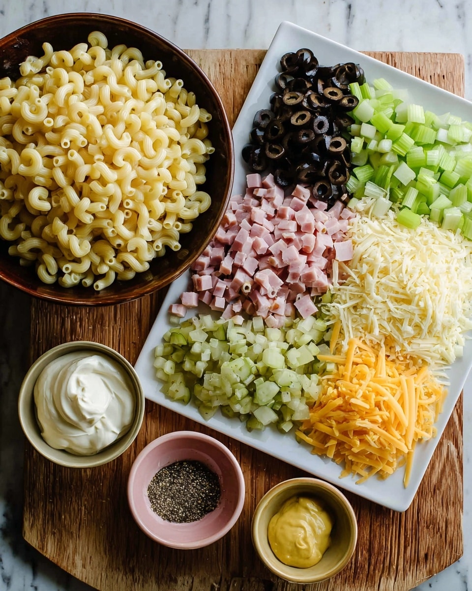 The image shows ingredients for a dish on a wooden board with a white marbled background. On the left, a deep dark brown bowl is filled with cooked elbow macaroni, showing its pale yellow color and smooth texture. To the right, a large white rectangular plate holds six piles of finely chopped ingredients arranged in two rows: diced light green celery at the top left, dark chopped black olives below it, chopped pale green pickles below the olives, diced pink ham next to the celery, shredded yellow cheese below the ham, and diced white cheese with an orange rind next to the yellow cheese. Below these bowls on the board are three small bowls: one with creamy white mayonnaise on the left, one with yellow mustard in the middle, and a small pink bowl with ground black pepper to the right of the mayonnaise. The arrangement is neat and ready for mixing. Photo taken with an iphone --ar 4:5 --v 7