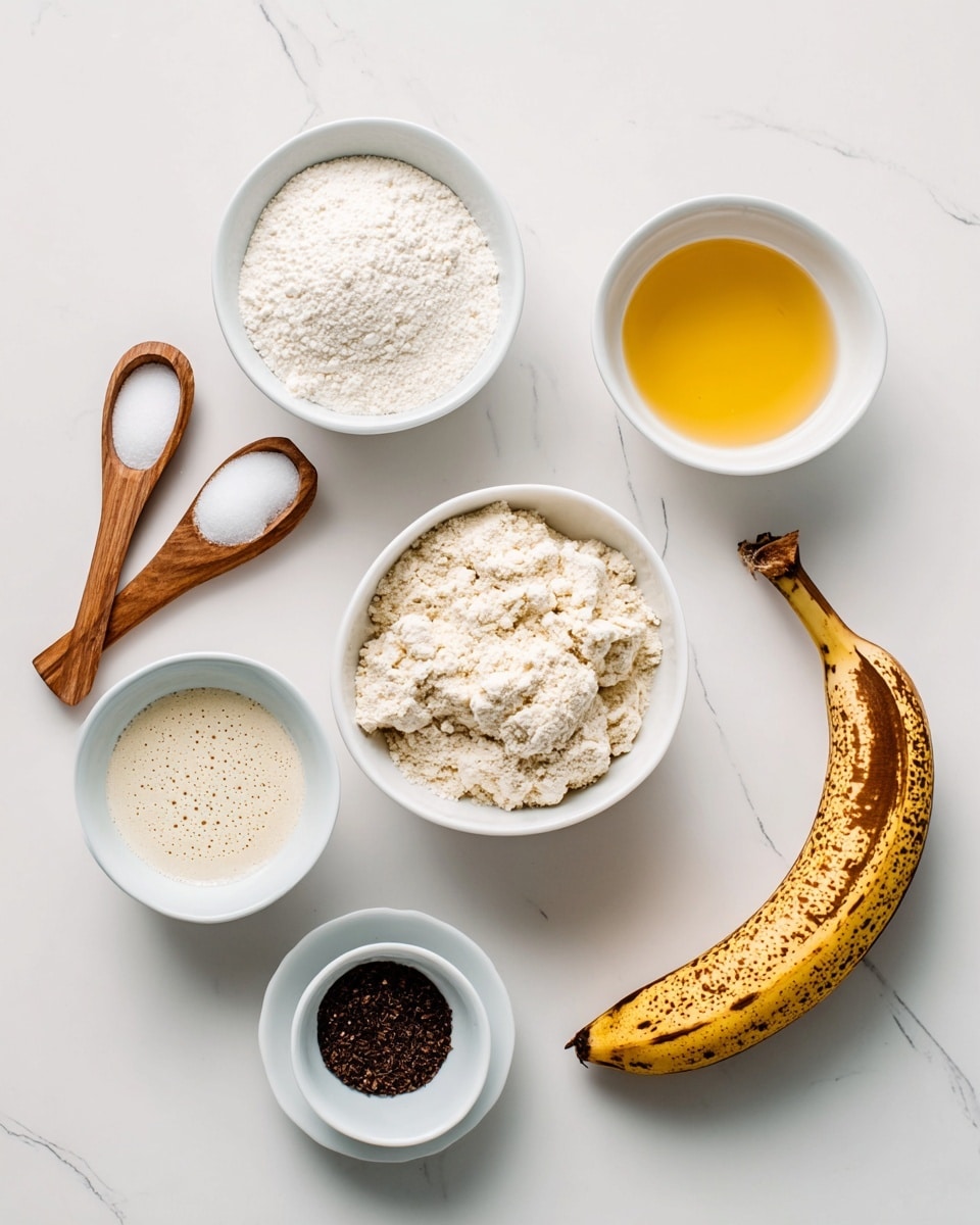 The image shows cooking ingredients set on a white marbled surface. In the center, there is a white bowl filled with a light, crumbly powder. To its top left, another white bowl holds white flour, and to its right, a white bowl with golden liquid, likely oil. Below the flour bowl is a white bowl with pale beige liquid with small bubbles on the surface. Below the crumbly powder bowl, a small white bowl contains dark brown ground spice. Two cinnamon sticks are placed below the spice bowl. To the far right, a ripe banana with brown spots lies flat. Near the top left corner, two wooden spoons hold small amounts of white powder. The setup is simple and organized, with soft, natural lighting. Photo taken with an iphone --ar 4:5 --v 7