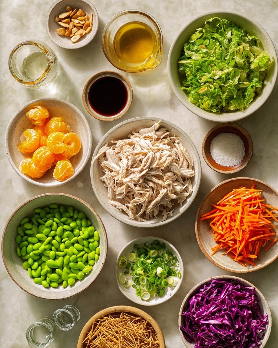 The image shows many small bowls and plates of colorful food items laid out on a white marbled surface. In the center is one bowl filled with shredded pale beige chicken. Surrounding it are bowls with different ingredients: bright green chopped lettuce on the top right, thin orange carrot strips on the middle right, thin purple cabbage strips on the bottom left, and a large bowl of bright green edamame beans on the middle left. There are also smaller bowls with mandarin orange segments, sliced almond nuts, chopped green onion, soy sauce in a tiny pitcher, clear liquid in a small glass bowl, chili oil in a glass bowl, brown sugar in a small dish, salt and pepper in another small dish, freshly minced garlic in a small white dish, and crispy thin brown noodles in a white bowl. The bowls are white or light-colored, except a few wooden bowls holding the almonds, green onion, and lettuce. The lighting is natural and soft, creating a fresh and clean look photo taken with an iphone --ar 4:5 --v 7