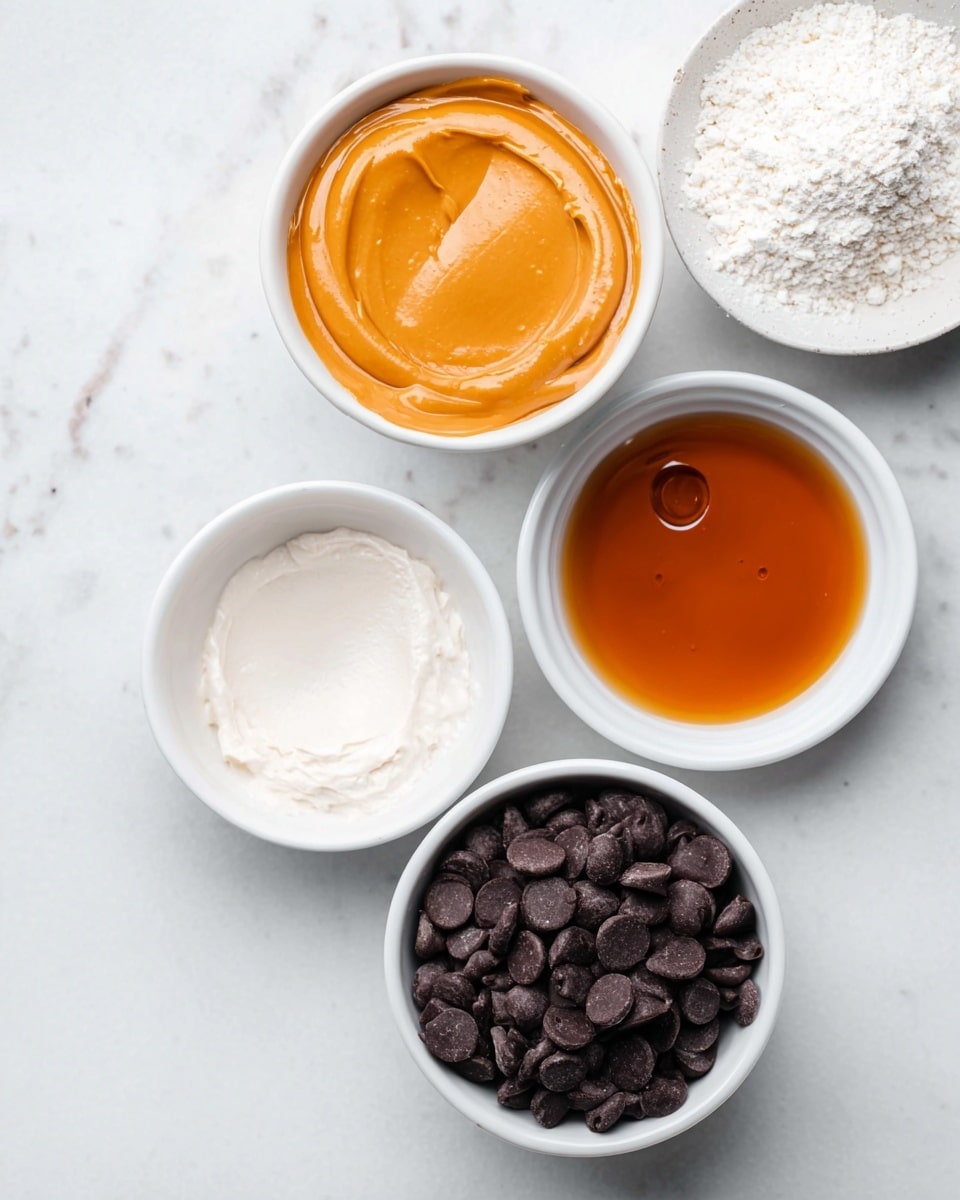 The image shows nine white bowls and cups, each holding a different ingredient, placed on a white marbled surface. At the top center, there is a bowl filled with dark, wrinkled dates. To the right of it, another bowl contains bright orange shredded carrot. Below the dates is a small cup filled with golden brown syrup. Next to it, a white cup is filled with large walnut pieces. To the left of the walnuts is a bowl of mixed cashew nuts. At the bottom right, there is a small bowl with light brown powder. Above it, another bowl contains pale yellow almond flour. To the right of the carrot bowl, a whole lemon rests on the surface. Near the center right is a bowl filled with fine white shredded coconut. All items are arranged neatly and the light is soft, with shadows gently cast around the bowls. photo taken with an iphone --ar 4:5 --v 7