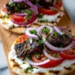Juicy Oven-Baked Kebabs with Garlic Yoghurt and Sumac Onions Recipe