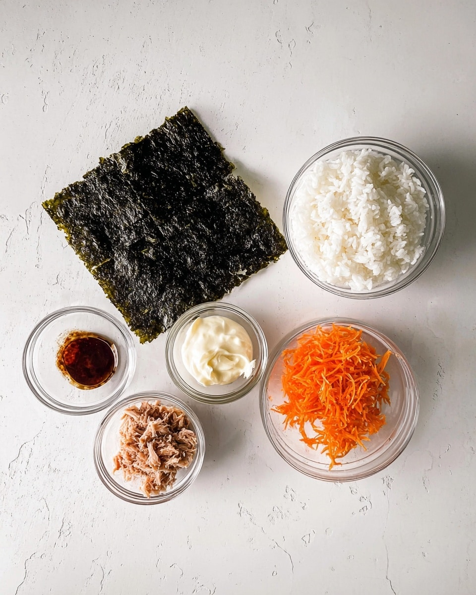 A flat square piece of dark green seaweed is placed in the center on a white marbled surface. Above it, to the right, there is a clear glass bowl filled with white cooked rice that looks soft and fluffy. To the right of the seaweed, a small clear glass bowl contains thin orange shredded carrots. Below the carrots bowl, another clear bowl holds light brown tuna flakes with a soft, moist texture. To the left of the tuna bowl, there is a small glass bowl with a creamy, thick white mayonnaise-like sauce. Finally, to the left of the seaweed, a very small clear bowl contains a dark reddish-brown sauce. Everything is neatly arranged on the white marbled surface. photo taken with an iphone --ar 4:5 --v 7