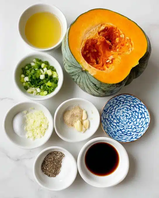 A large green pumpkin with an orange inside is cut in half, placed on the right side of the image. On the left, seven small white bowls hold different ingredients: one with light yellow liquid, one with white powder, one with chopped green onions, one with coarse salt and black pepper, one with minced beige garlic, one with dark liquid, and one decorated with a blue and white geometric pattern but empty. All are arranged on a white marbled surface. photo taken with an iphone --ar 4:5 --v 7