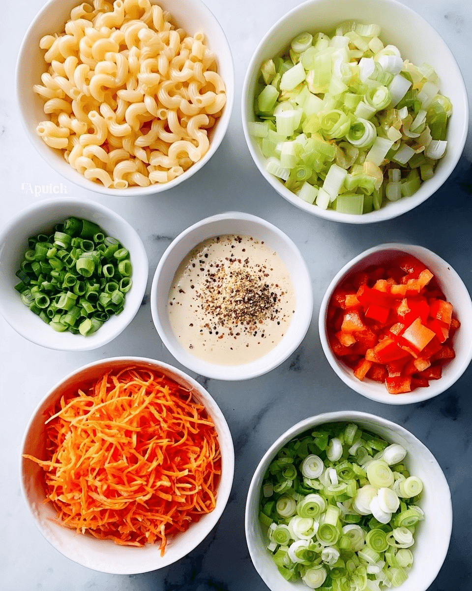 Seven white bowls sit on a white marbled surface, each filled with different ingredients. The top left bowl holds pale yellow cooked macaroni, curving softly. To the right, a bowl is filled with chopped light green celery pieces. Below the celery, a bowl contains finely diced bright red pepper. At the bottom center, chopped green onions with white bases and green tips fill a bowl. To the left of green onions, a bowl holds shredded orange carrots with thin, stringy texture. Below the macaroni and to the left of the carrot, a bowl contains a creamy dressing with layers of beige, white, and light brown colors, topped with black pepper and other spices in small patches. The overall look is clean, colorful, and organized with contrasting fresh vegetable colors. Photo taken with an iphone --ar 4:5 --v 7