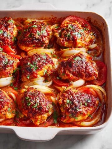 Baked Chicken Thighs with Spiced Tomato Rub and Roasted Onions Recipe