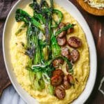 Creamy Cheddar Polenta with Sausage and Charred Ramps Recipe
