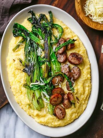 Creamy Cheddar Polenta with Sausage and Charred Ramps Recipe