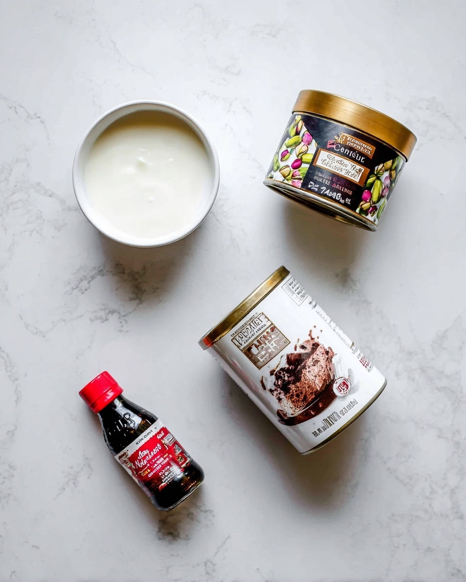 A top-down view of four items on a white marbled surface: a white bowl filled with a smooth white liquid in the top left, a jar of pistachio cream with a gold lid and dark label featuring colorful pistachio images in the top right, a can of sweetened condensed milk with a white and brown label showing a chocolate dessert tilted at an angle in the bottom left, and a small dark bottle of almond extract with a red cap and red and white label in the bottom right, all spaced apart evenly photo taken with an iphone --ar 4:5 --v 7