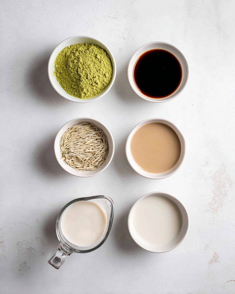 The image shows six small white bowls and a clear glass measuring cup arranged neatly on a white marbled surface. The top left bowl has a bright green powder, the bowl to the right of it contains a dark brown liquid. Below the green powder, there is a bowl filled with thin light beige strands, while next to it on the right is a bowl with a creamy light brown sauce. At the bottom left, the clear glass measuring cup is filled with a white liquid, and to its right is another white bowl with a similar white liquid. The setting is clean and simple with a soft natural light. photo taken with an iphone --ar 4:5 --v 7
