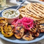 Grilled Chicken Thighs with Sumac, Pickled Onions, and Charred Lemon Recipe