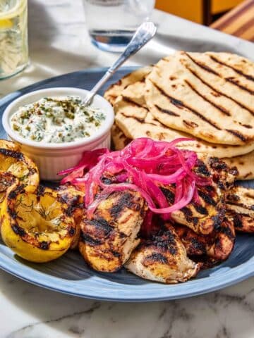 Grilled Chicken Thighs with Sumac, Pickled Onions, and Charred Lemon Recipe
