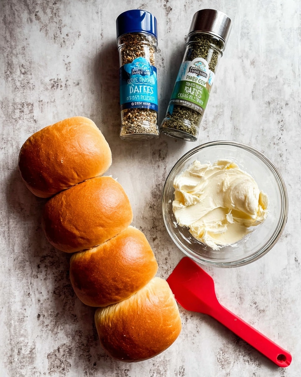 The image shows four soft golden brown sandwich buns lined up on a white marbled surface on the left side. To their right, there is a clear glass bowl with creamy white butter inside, and a red silicone spatula resting in the bowl. Next to the bowl, there are two spice bottles standing upright, one with a blue label showing garlic and salt, and the other with a green label containing green parsley flakes. The colors are warm and natural, set on a light white marbled surface with a simple and clean look. photo taken with an iphone --ar 4:5 --v 7