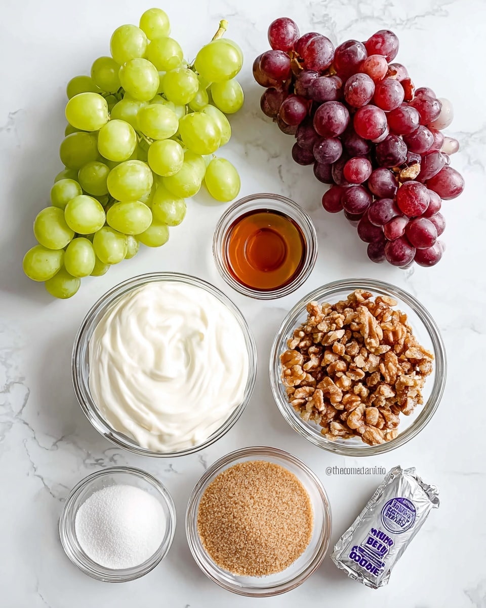 The image shows several ingredients neatly arranged on a white marbled surface. On the top left, there is a bunch of green grapes with round, smooth, light green skins, and next to it on the right side, a bunch of red grapes with dark red and purple tones. Below the grapes, towards the center, is a clear glass bowl filled with thick, white creamy yogurt. To its right, there is another clear glass bowl filled with small, chopped brown nuts, with rough textures. Below the yogurt bowl, there is a clear glass bowl filled with light brown soft brown sugar, grainy in texture. To the left of the brown sugar, there is a glass bowl containing fine white granulated sugar. Above the white sugar, there is a small glass bowl holding a dark amber liquid, likely vanilla extract. On the far right, near the bottom, is a rectangular silver-wrapped package of cream cheese with blue text and logos visible on the wrapping. The items are spaced evenly and arranged carefully with bright, natural light. photo taken with an iphone --ar 4:5 --v 7