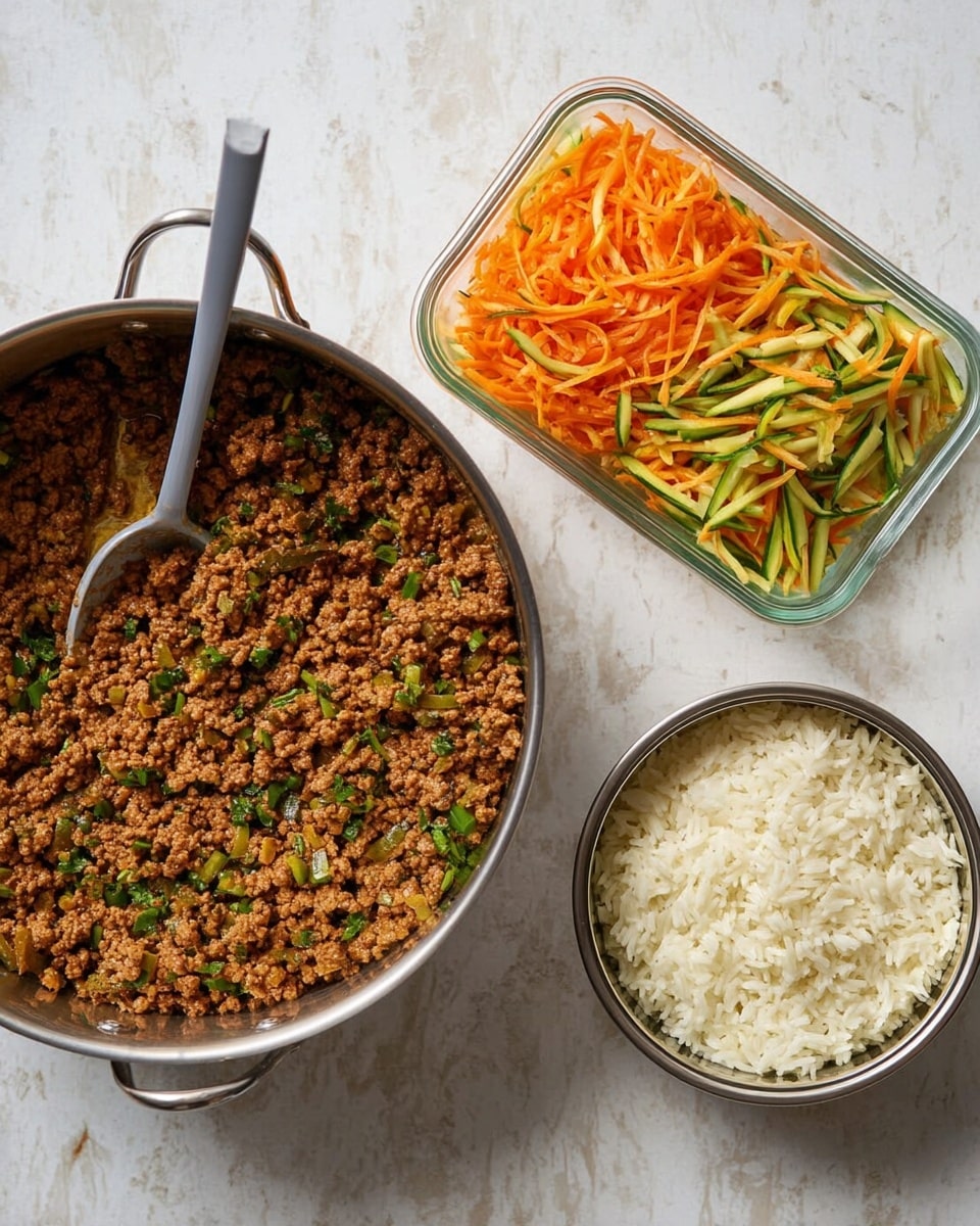 The image shows three containers on a white marbled surface: a large metal pan on the left filled with brown cooked ground meat mixed with small green herbs, a glass rectangular dish at the top right with a colorful salad of orange shredded carrots and green sliced cucumbers, and a smaller metal pan at the bottom right containing fluffy white cooked rice. A gray spoon rests inside the meat pan. Photo taken with an iphone --ar 4:5 --v 7