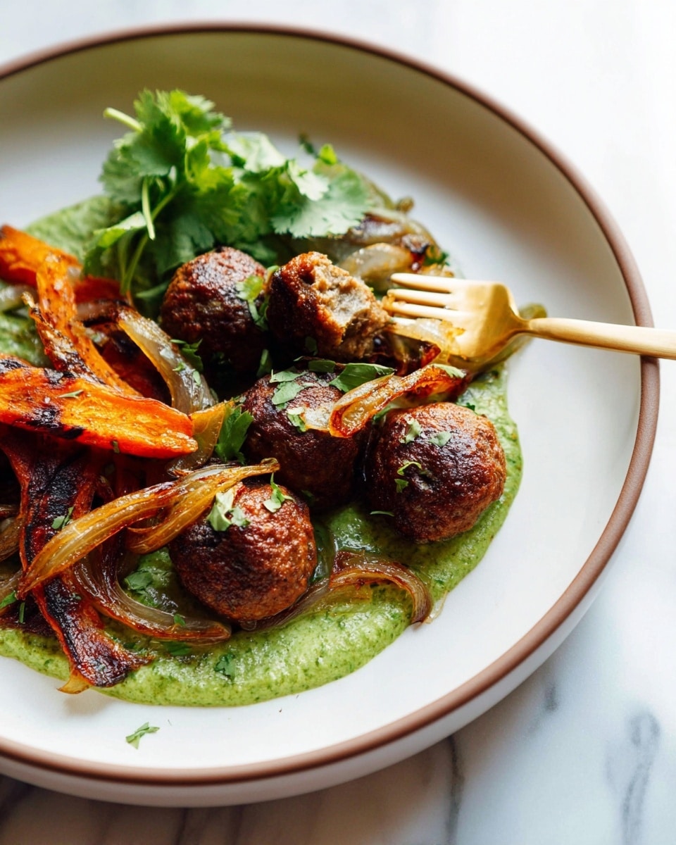 In a shallow white bowl with a thin brown rim, there are six small brown meatballs placed on a green sauce spread in a semi-circle. On the right side, there are crispy orange-brown slices of roasted vegetables with slightly burnt edges. Thin, caramelized onion strips with a reddish-brown color rest on top of the vegetables. A gold fork is piercing one meatball, positioned diagonally across the bowl. A small bunch of fresh green herbs is placed behind the meatballs. The bowl is set on a white marbled surface. photo taken with an iphone --ar 4:5 --v 7