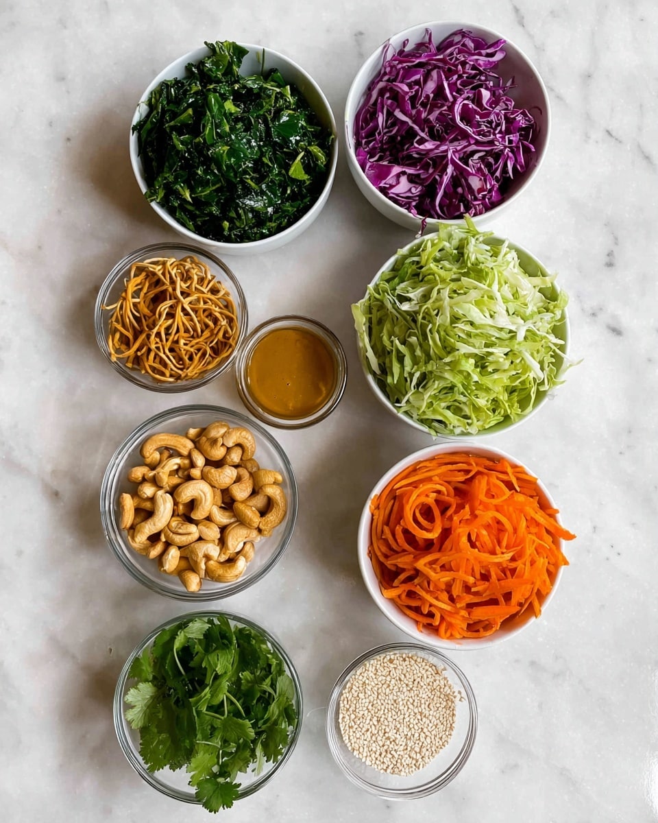 Nine small white bowls are placed on a white marbled surface, each with different food items. The top left bowl is filled with dark green chopped leafy greens, while the top right bowl holds thin, purple cabbage strips. Below these, a small bowl on the left contains light brown crunchy noodles, and next to it is a glass bowl with smooth, light brown dressing. On the right side, there is a bowl full of pale green shredded cabbage. Below, a bowl with bright orange shredded carrots is centered above a bowl of light brown roasted cashews. At the bottom center, a small bowl holds fresh green cilantro leaves, and on the bottom right, a small bowl is filled with white sesame seeds. Photo taken with an iphone --ar 4:5 --v 7