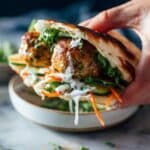 Ginger Chicken Meatball Sandwiches with Cilantro, Mint, and Chili Crisp Recipe