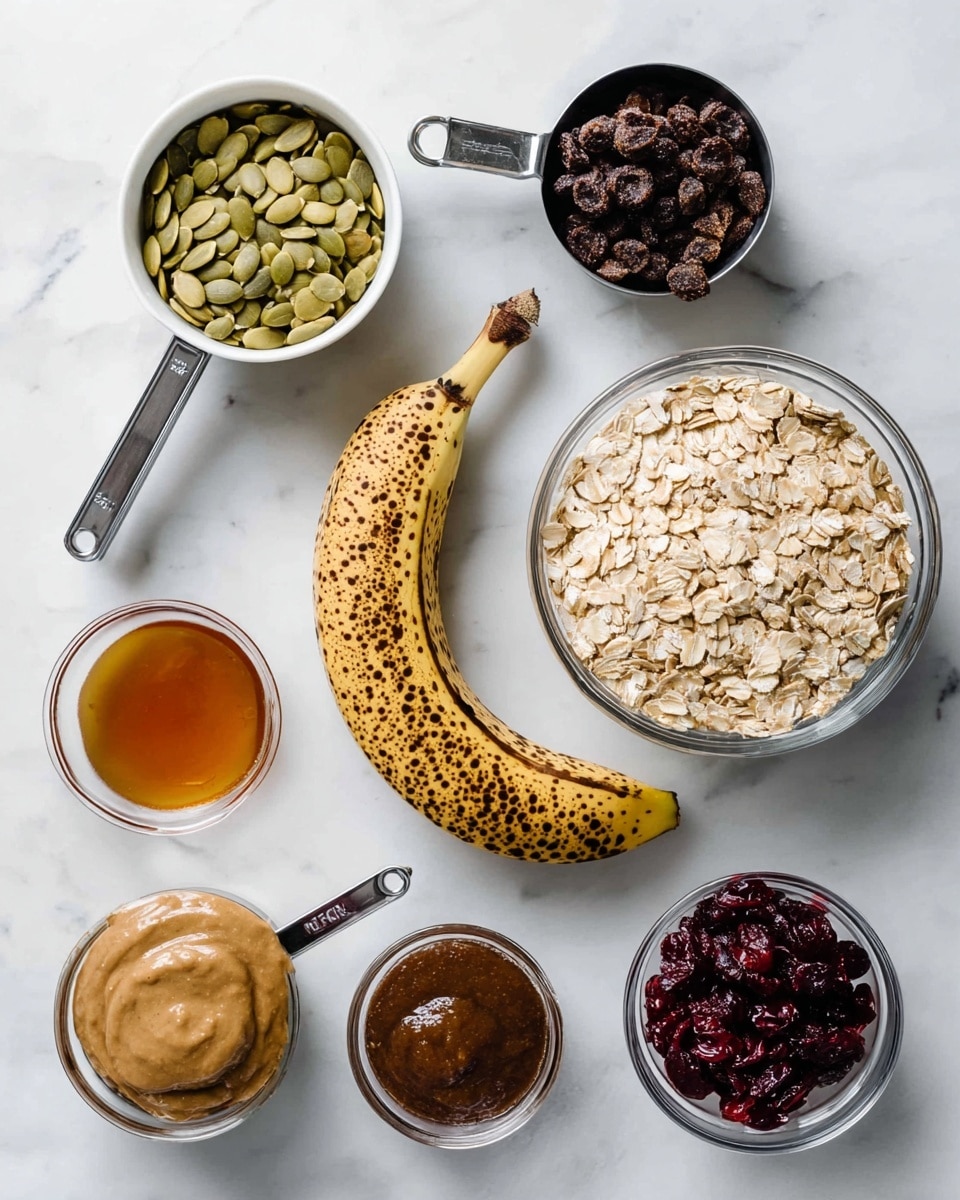 A variety of ingredients are arranged on a white marbled surface, including a ripe spotted banana placed diagonally in the center. Above the banana are three white containers: one filled with light green pumpkin seeds on the left, a metal measuring cup with dark brown raisins in the middle, and a clear glass bowl containing light beige rolled oats on the right. Below the banana, from left to right, there is a small clear bowl filled with amber maple syrup, a metal measuring cup with creamy almond butter, a metal measuring cup with dark brown applesauce, and a small clear bowl with brown ground cinnamon. Another small clear bowl with dark red dried cranberries sits to the right of the applesauce. photo taken with an iphone --ar 4:5 --v 7