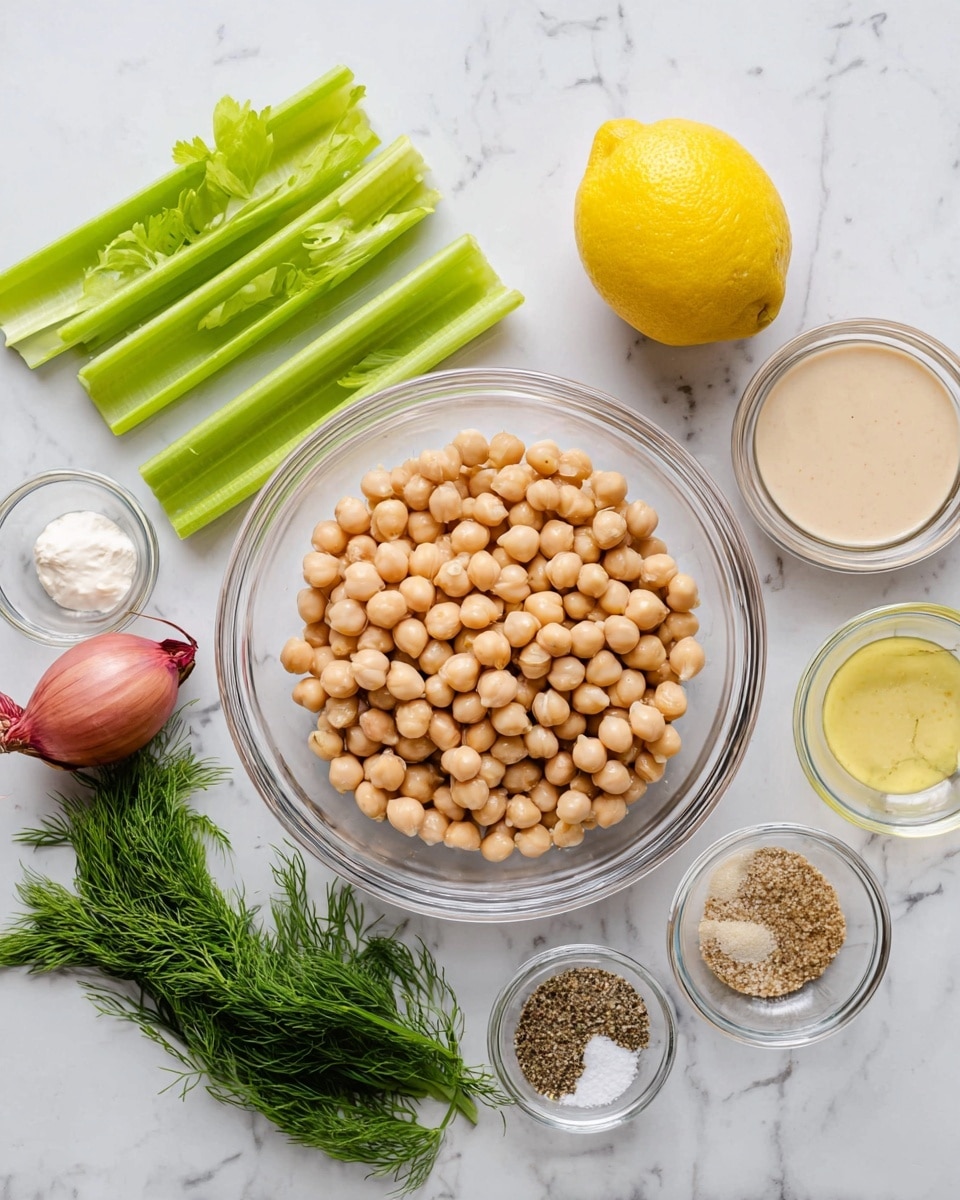 A clear glass bowl filled with beige round chickpeas sits in the center on a white marbled surface. To the left of the bowl, there are two fresh green celery sticks and a small clear bowl with a thick white creamy ingredient below the celery. Above the celery, another small clear bowl holds a light tan liquid. On the top right side near the chickpeas, there is a whole lemon with bright yellow color and a small reddish shallot. Below the lemon, a small bunch of fresh green dill is placed. To the right of the dill, three clear small bowls contain different ingredients: a pale yellow creamy substance on top, a clear light yellow liquid in the middle, and a mix of ground black pepper and salt at the bottom. The whole scene is bright and clean. photo taken with an iphone --ar 4:5 --v 7