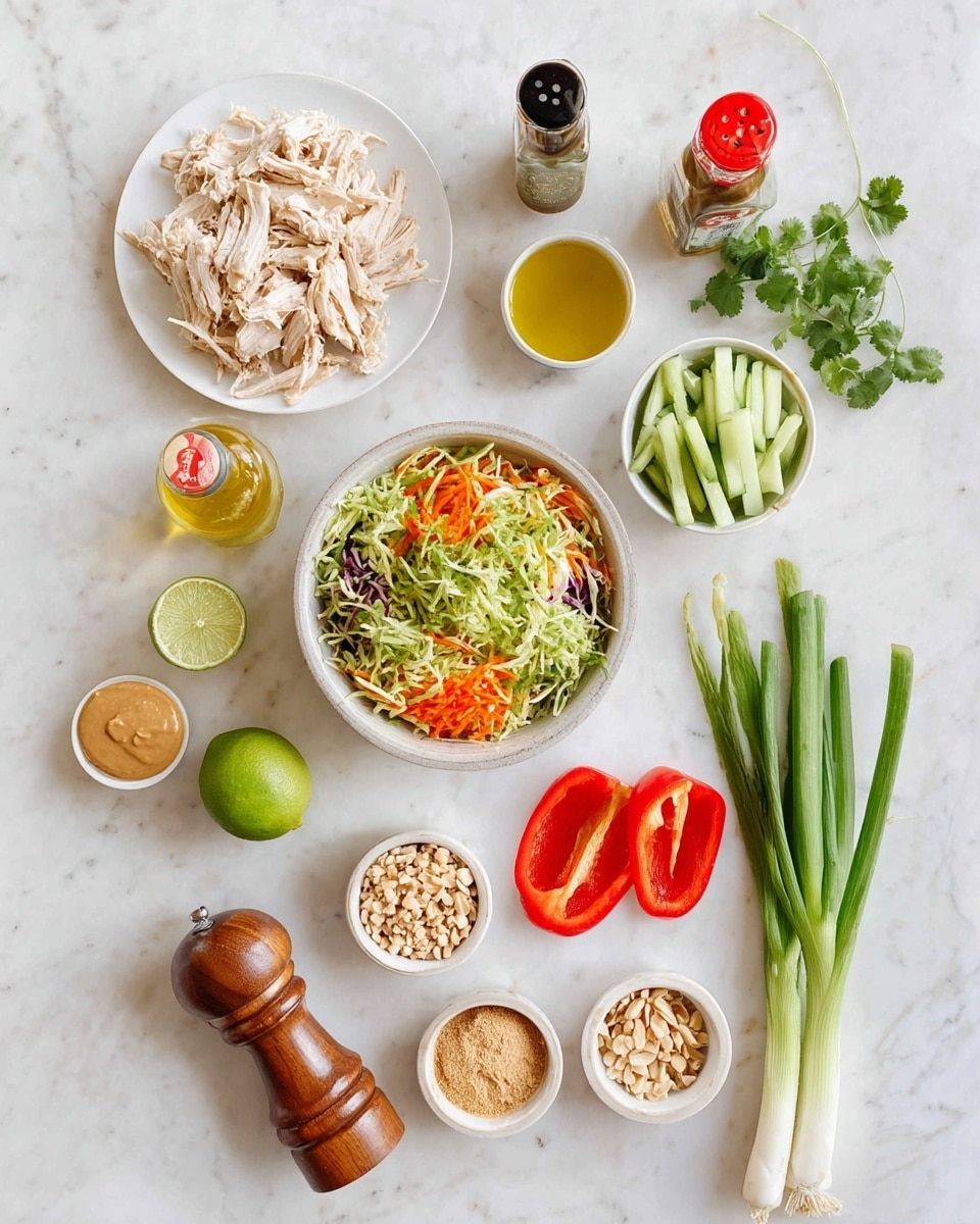 The image shows a white plate with shredded cooked chicken on the top left. Below it, a white bowl holds a mix of shredded vegetables in green, orange, and purple colors. To the right of the chicken, there is a smaller white bowl with green cucumber sticks. Next to it, two small white bowls hold a light brown powder and small chopped nuts. A halved lime with a bright green interior is placed near the center. Nearby, there are two halves of a red bell pepper showing their shiny interior, while three green spring onions with white bulbs lie near the bottom right. Additional small bowls contain light brown and beige powders, a small container of peanut butter, and a glass bottle with yellow oil. A wooden pepper grinder and a small bottle of soy sauce with a red cap are near the bottom left. A red chili pepper and some fresh green cilantro sprigs are near the top right. Everything is arranged neatly on a white marbled surface photo taken with an iphone --ar 4:5 --v 7