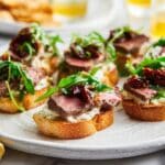 Steak Crostini with Goat Cheese and Sun-Dried Tomato Dressing Recipe
