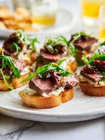 Steak Crostini with Goat Cheese and Sun-Dried Tomato Dressing Recipe