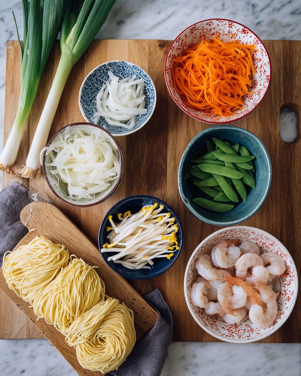 The image shows a wooden table with six dishes and a wooden board of raw noodles arranged neatly. In the top left, there are fresh green onions lying on the table. Below them, a white bowl with a red pattern holds thin white sliced rounds, while a blue bowl with an intricate pattern holds thin orange carrot strips. To the right, a white bowl contains green snap peas. Below that, a blue bowl holds white bean sprouts with yellow tips. Near the center, a small white bowl with a blue pattern has pale bamboo shoots. At the bottom right, a white bowl with a red star pattern is filled with raw shrimp, tails showing, above a grey cloth. The wooden board at the bottom left holds tightly bundled raw yellow noodles. The entire scene rests on a white marbled surface. photo taken with an iphone --ar 4:5 --v 7