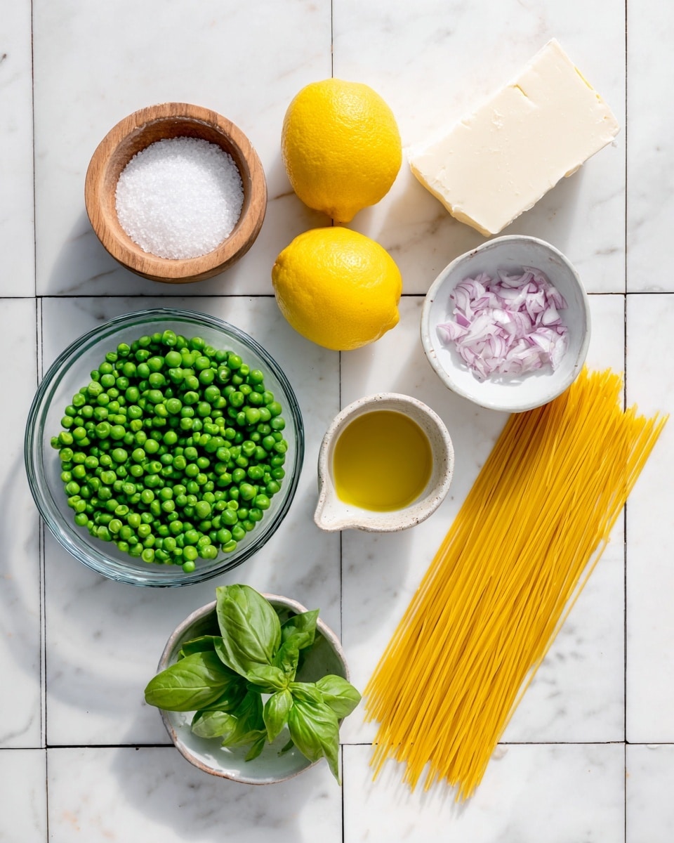 The image shows ingredients arranged on a white marbled surface with a grid of black lines. At the top left is a small wooden bowl filled with white salt. Next to it, slightly to the right, there are two halves of a bright yellow lemon placed side by side. To the right of the lemons, there is a small white bowl filled with finely chopped light purple onions. Below these items, a transparent glass bowl contains a large amount of vibrant green peas. To the right of the glass bowl is a neat bundle of dry yellow spaghetti noodles laid flat. Below the spaghetti is a small ceramic cup filled with a golden yellow liquid, likely olive oil. At the bottom left, a small white plate holds a single block of white cheese. Finally, at the bottom right, a white bowl contains fresh green basil leaves. The setup is simple and bright. photo taken with an iphone --ar 4:5 --v 7