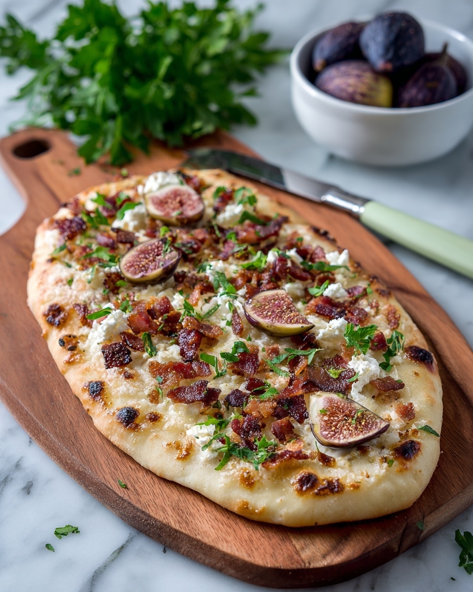 A flatbread with a golden-brown crust sits on a wooden cutting board, topped with three layers: small chunks of crispy bacon scattered over a layer of crumbled white cheese, and dark purple fig halves placed evenly on top, garnished with small green herb leaves. The flatbread's crust is slightly puffed and uneven around the edges. Next to the board is a bunch of fresh green parsley and a knife with a mint green handle, all placed on a white marbled surface. A white bowl filled with whole dark figs is also visible at the bottom right corner. Photo taken with an iphone --ar 4:5 --v 7