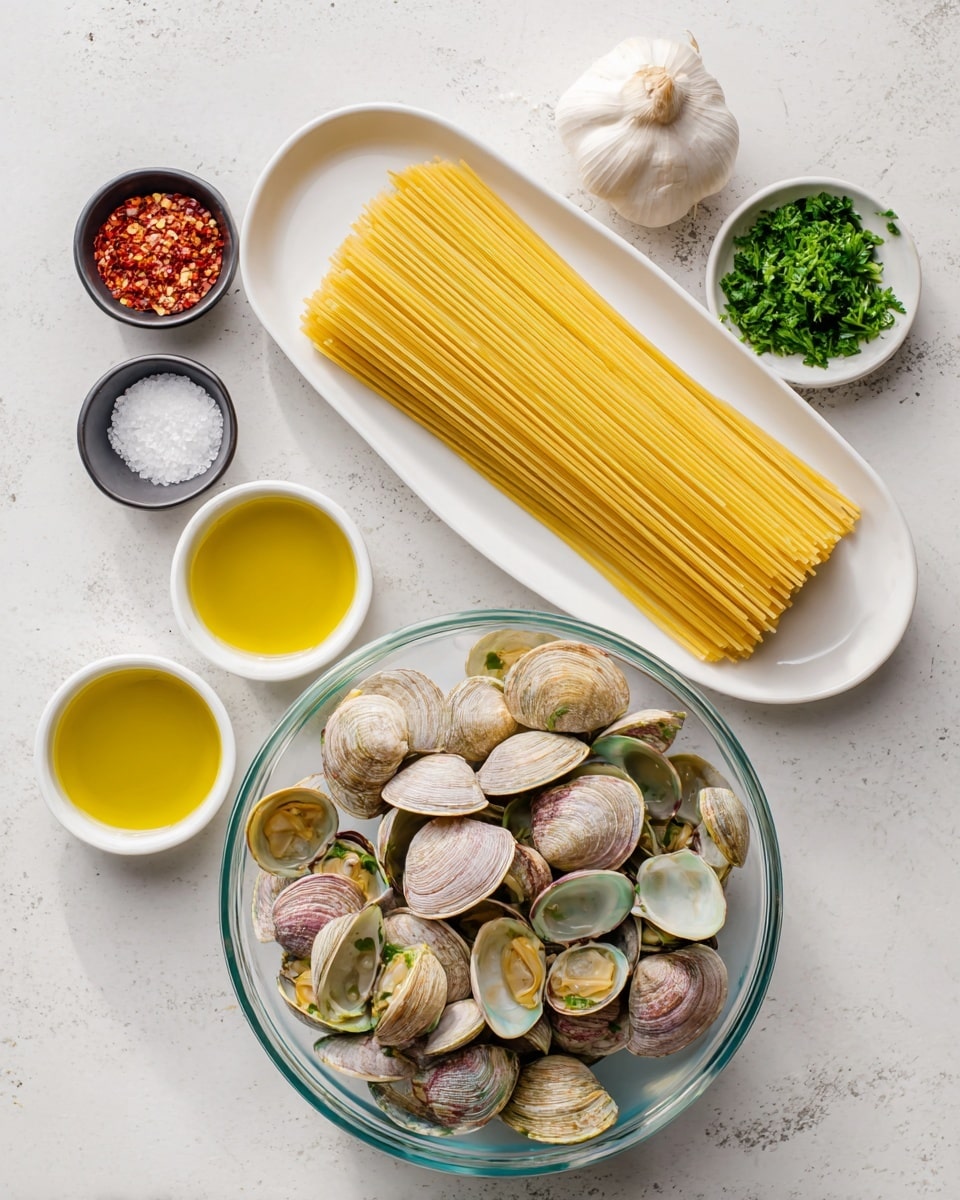 The image shows a top-down view of ingredients arranged on a white marbled surface. In the center, there is a clear glass bowl filled with fresh clams, pale beige and light green in color with natural shell patterns. Above the bowl, a long white oval plate holds a neat stack of uncooked yellow spaghetti. Surrounding the bowl are small white bowls containing golden olive oil, bright green chopped parsley, and a light yellow liquid. There are also two small black bowls holding a single garlic clove and coarse white salt. A small white bowl with red chili flakes is placed near the top left. The overall setup is clean and organized with natural light highlighting the textures and colors of the ingredients. Photo taken with an iphone --ar 4:5 --v 7