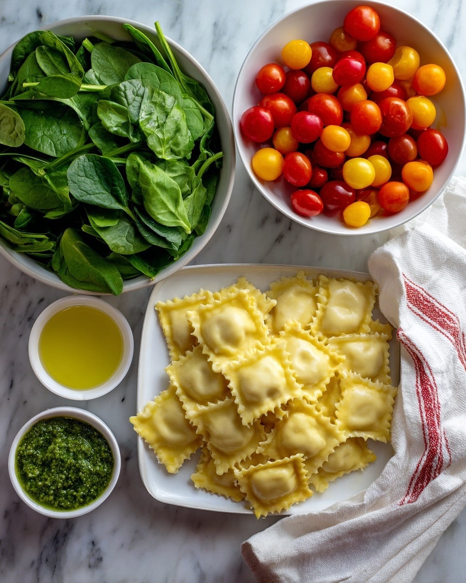 The image shows a white bowl filled with fresh, green spinach leaves on the left side, next to a white bowl of colorful cherry tomatoes in red, yellow, and orange on the top right. Below the tomatoes, there is a white dish holding a pile of square-shaped ravioli with ruffled edges and a pale yellow color. On the bottom left, a small white bowl contains a green pesto sauce, and beside it, another small white bowl holds a light yellow liquid, likely olive oil. All dishes are set on a white marbled surface with a white cloth napkin featuring red and black stripes on the right side. Photo taken with an iphone --ar 4:5 --v 7