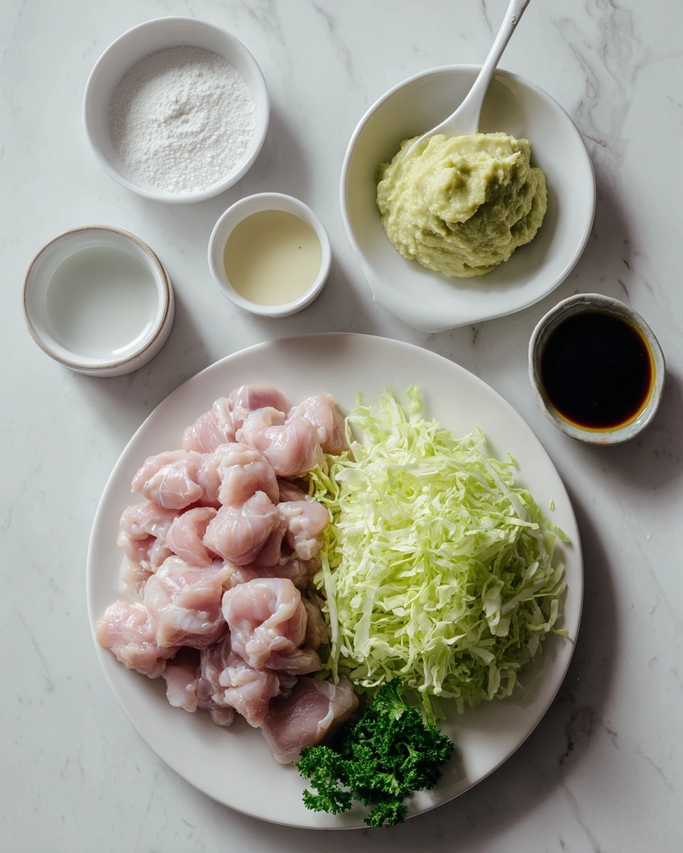 The image shows a white plate on the right side filled with two layers: the bottom layer is a pile of light green shredded lettuce, topped on the lower right side with a small bunch of curly parsley in dark green. On the left, there is a white plate with raw pink chicken pieces piled in a loose mound. Above this plate, there are four small white containers arranged in a row: a round bowl with white powder on the far left, a small measuring cup with a white liquid next to it, a tiny bowl with a pale cream thick liquid, and a small round bowl with dark brown soy sauce. Above these containers, a white spoon holds a thick mashed pale yellow paste. All items are placed on a flat white marbled surface. photo taken with an iphone --ar 4:5 --v 7