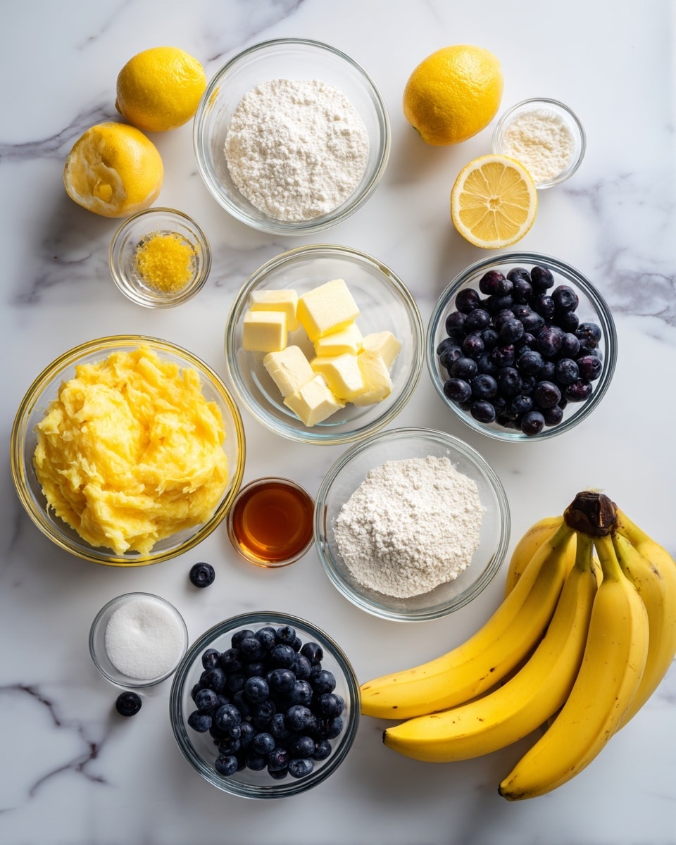 The image shows a top-down view of several clear glass bowls and a bunch of bananas arranged on a white marbled surface. The bowls contain different ingredients: bright yellow mashed bananas, dark blue fresh blueberries, white sugar, white flour, small cubes of butter, two whole eggs with yolks, a small amount of lemon zest, and a small glass of amber-colored vanilla extract. There are also two lemon halves, a few loose blueberries scattered on the surface, and some baking powder or soda in small bowls. The bananas are bright yellow with dark tips, and everything is neatly spaced, creating a clean and organized look. photo taken with an iphone --ar 4:5 --v 7