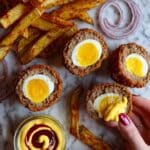 Delicious Homemade Scotch Eggs with Crispy Potato Wedges and Fresh Salad Recipe