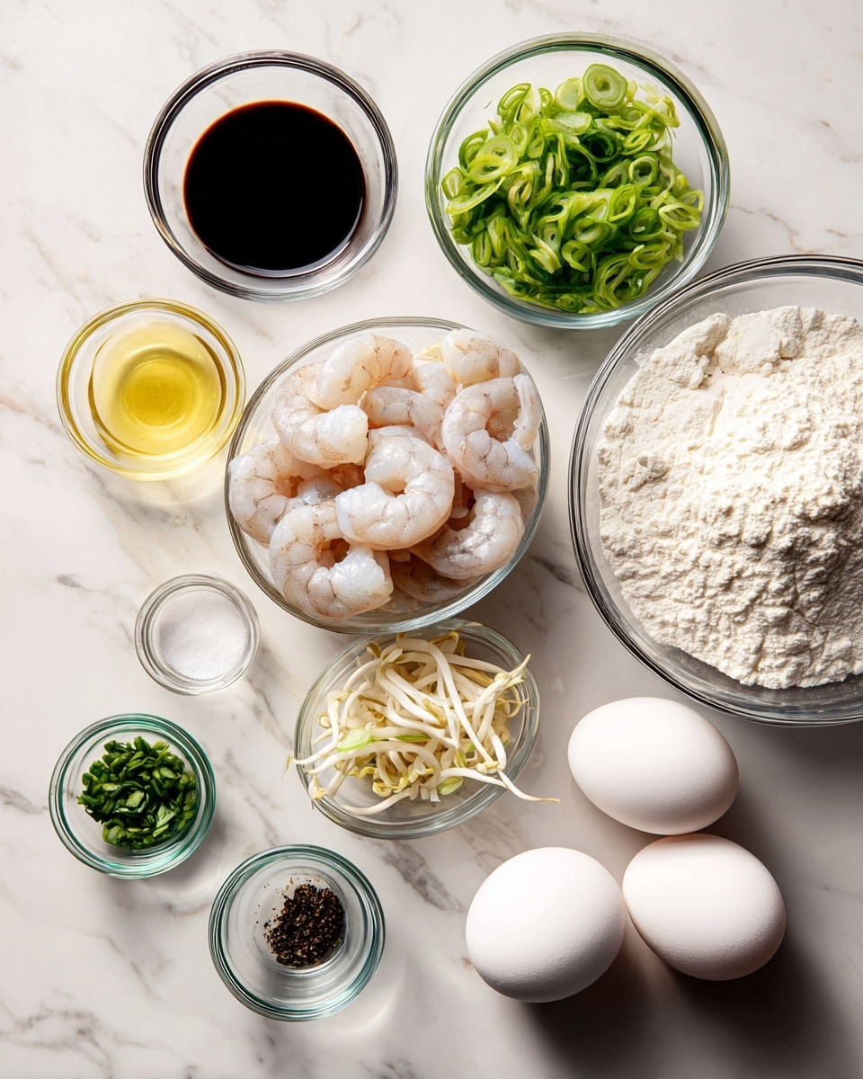 A clear food processor bowl is filled with raw grey shrimp pieces scattered evenly around. Over the shrimp are small green chopped herbs, a light dusting of white powder, and some orange zest spread in patches. The shrimp textures show some moisture and translucency, while the herbs add a fresh green touch. The scene is set on a white marbled surface. photo taken with an iphone --ar 4:5 --v 7