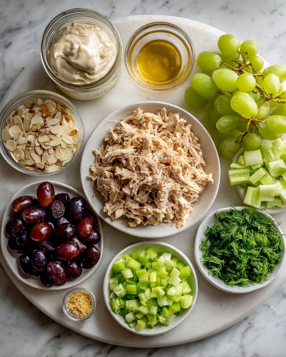 A white marbled surface holds seven white bowls and two clear small glass bowls arranged in a loose circle. The center bowl has shredded cooked chicken that is light brown and seasoned. Around it, the bowls contain bright green chopped celery, beige sliced almonds, a mix of fresh dark green dill and chopped green onions, dark purple sliced grapes, and more chopped light to medium green onion rings. One small glass bowl contains a light golden liquid, and the other has a dollop of grainy light yellow mustard. A glass jar to the left holds thick white mayonnaise. photo taken with an iphone --ar 4:5 --v 7