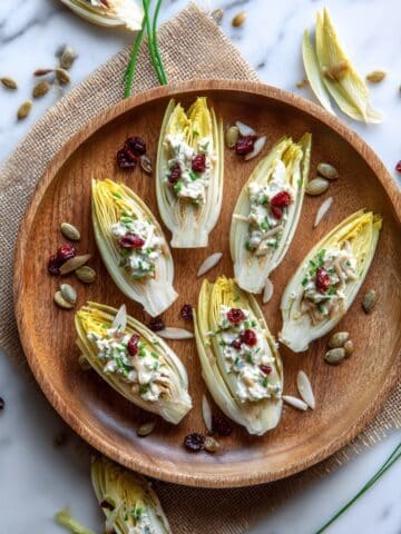 Endive Spear Appetizer with Celery Root Remoulade, Cranberries, and Pepitas Recipe
