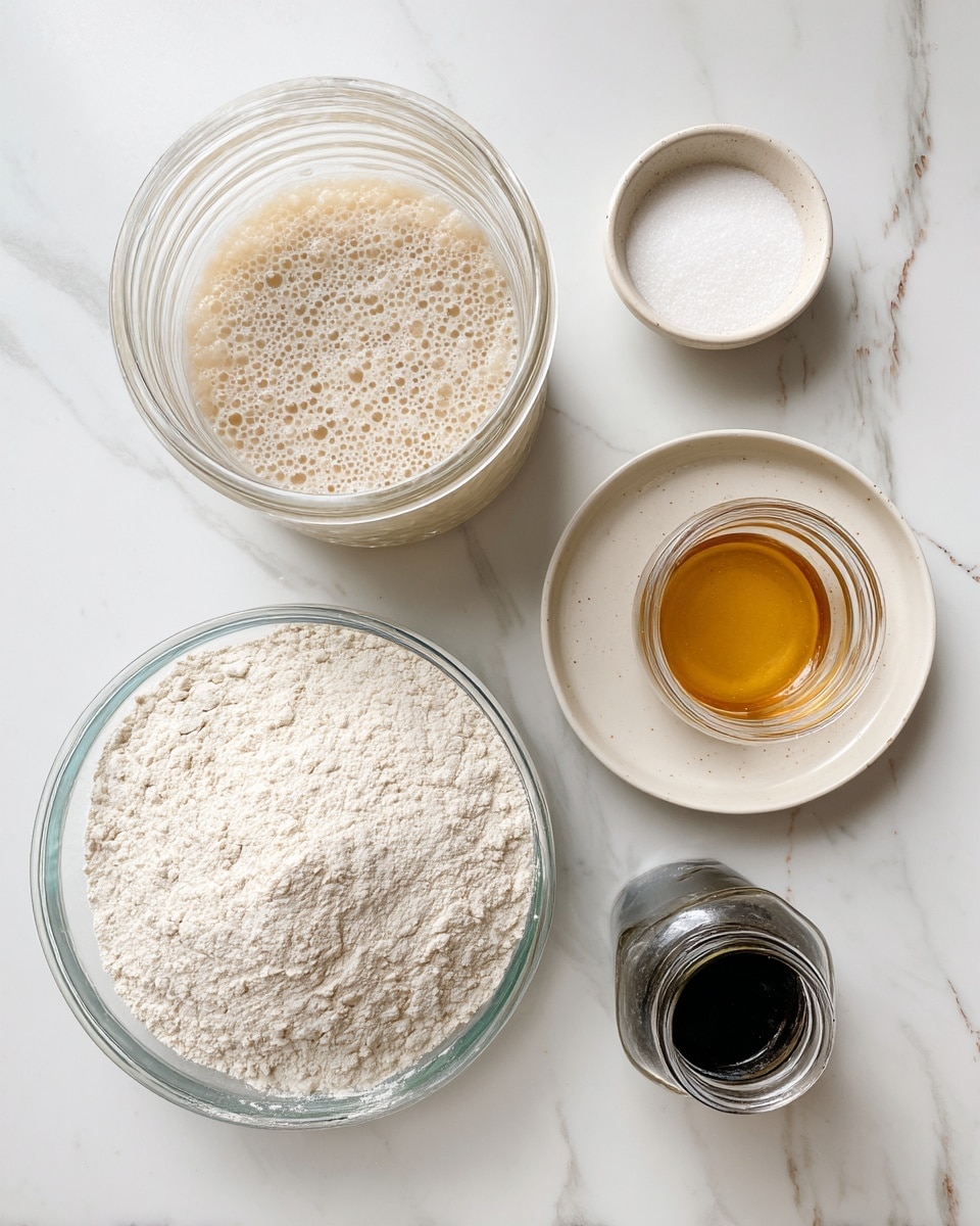 The image shows baking ingredients on a white marbled surface. On the left side, there is a clear glass bowl filled with white flour. Above it, a glass jar contains a bubbly, beige sourdough starter mix. To the right, a clear plate holds a small white bowl of white salt and a jar with golden honey, the jar lid lying beside it. At the bottom, part of a dark bottle is visible. The setup looks ready for baking. photo taken with an iphone --ar 4:5 --v 7