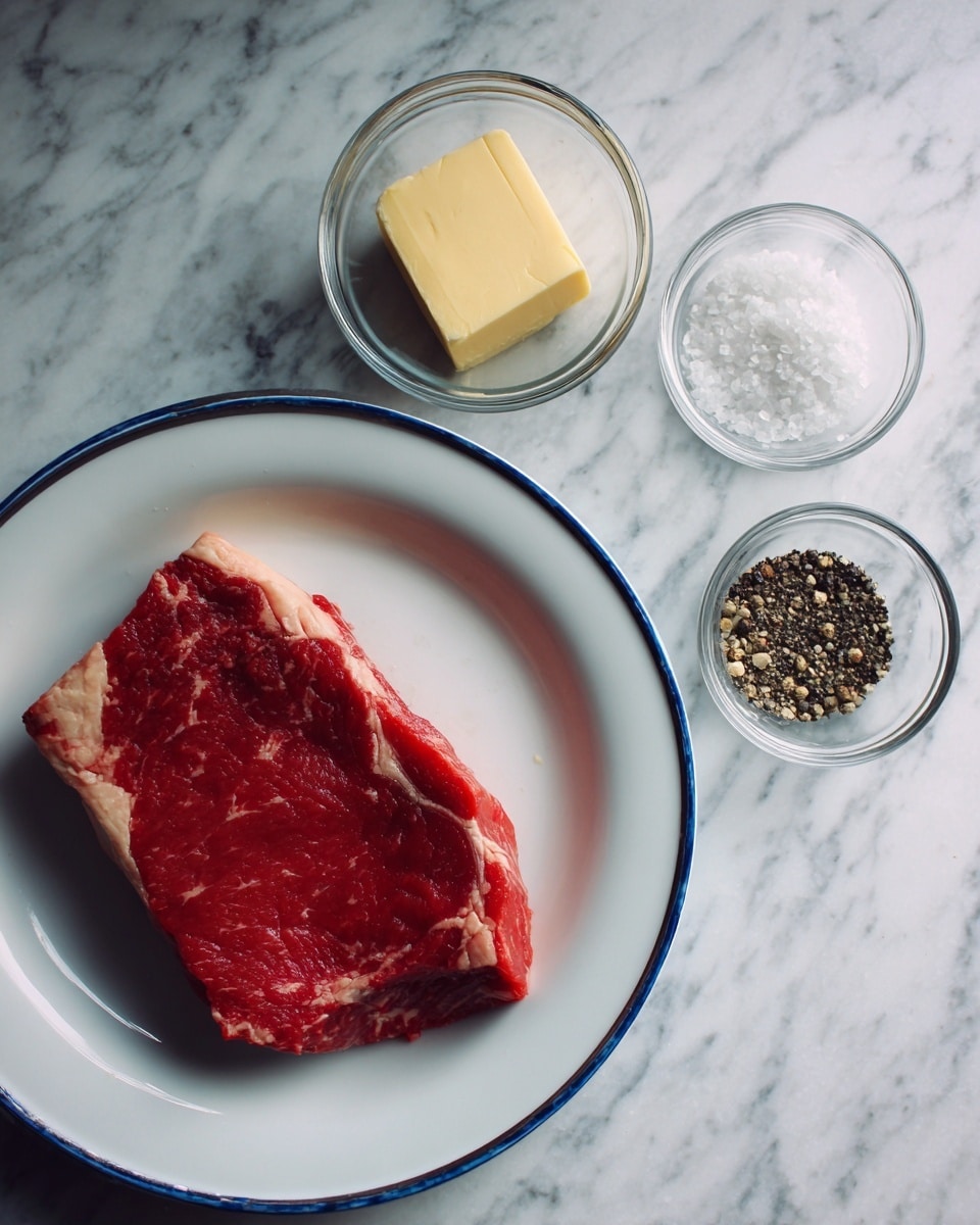 A raw piece of red steak with white fat edges lies on a white plate with a blue rim. Nearby, three small clear glass bowls are placed on a white marbled surface; one holds a pale yellow square of butter, the second contains white salt crystals, and the third has black pepper. The setting is simple and clean. Photo taken with an iphone --ar 4:5 --v 7
