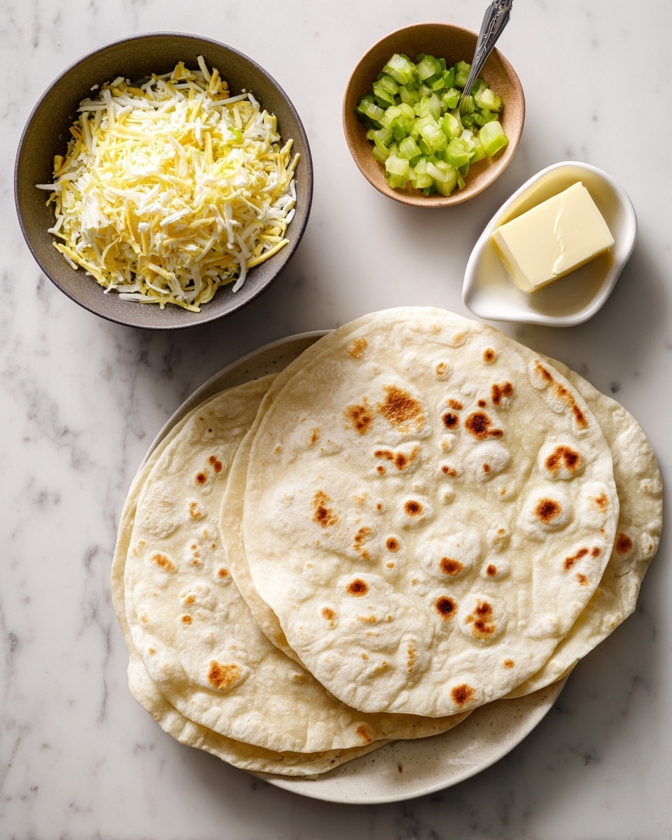 The image shows a top view of two white flour tortillas with light brown spots on a white marbled surface, placed side by side on the right. On the left, there is a dark bowl filled with a mix of shredded yellow and white cheese, next to a small white dish holding a square piece of pale yellow butter. Above the cheese bowl is a small light brown bowl with chopped green pickles and a silver spoon resting inside. The photo has bright, natural lighting. photo taken with an iphone --ar 4:5 --v 7