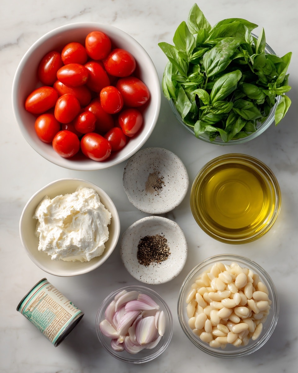 The image shows a top-down view of ingredients arranged on a white marbled surface. There is one full white bowl of bright red grape tomatoes on the top left. Next to it on the right is a clear glass bowl filled with fresh green basil leaves. Below the tomatoes is a small white bowl holding creamy white vegan cream cheese. In the center is a clear glass bowl filled with golden olive oil. To the right of the oil is a small speckled white bowl with mixed salt and black pepper. Below the olive oil is a clear glass bowl with thinly sliced light purple shallots. On the bottom right is a white bowl containing finely minced pale yellow garlic. At the bottom left is a can of butter beans tilted slightly, showing the label. The photo taken with an iphone --ar 4:5 --v 7