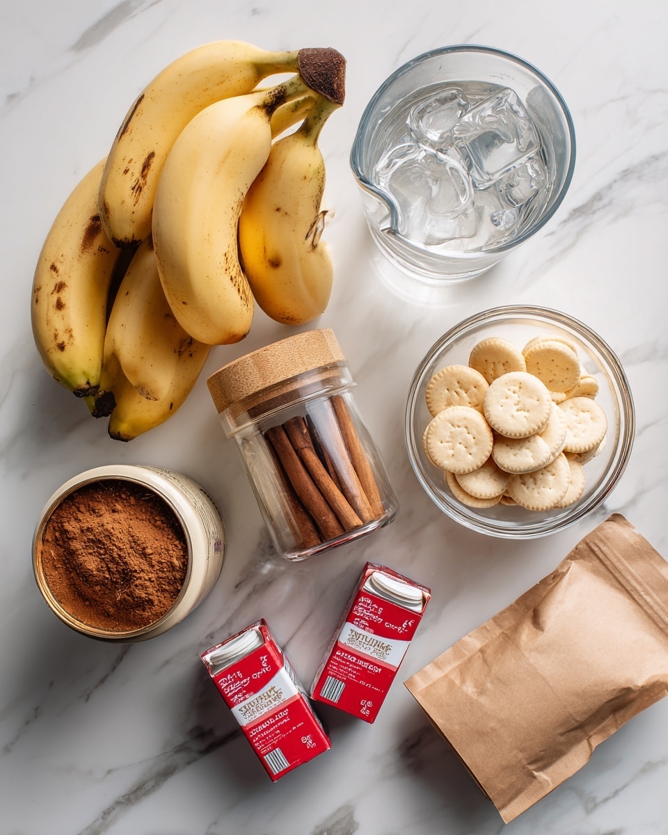 The image shows several ingredients arranged on a white marbled surface. There is a bunch of ripe yellow bananas with some brown spots at the bottom left, next to a glass jar filled with brown cinnamon powder and a wooden lid. Above the jar, there is a clear measuring cup with ice cubes and water inside. To the right of the cup are two small red cartons of heavy whipping cream with white caps. Above these are a glass bowl filled with round golden vanilla wafer cookies. Near the bottom right corner, there's a brown paper pouch, and to the left of that is an opened can of light beige condensed milk. Everything is neatly placed, with bright natural lighting. photo taken with an iphone --ar 4:5 --v 7