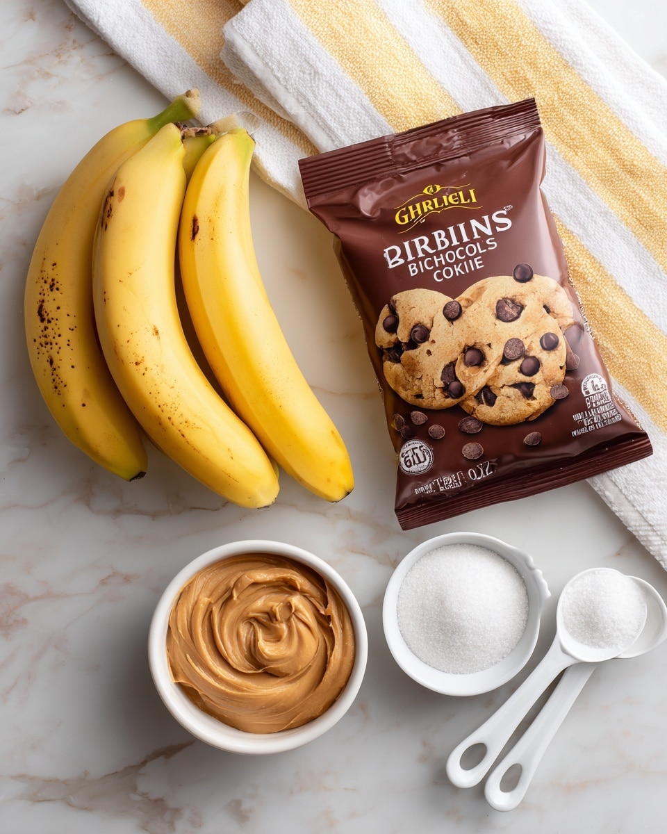 The image shows baking ingredients arranged on a white marbled surface. There are three yellow bananas with small brown spots on the left side. Above the bananas is a brown package of Ghirardelli 60% cacao bittersweet chocolate chips with chocolate chip cookie images on it. To the right of the bananas is a small white bowl filled with smooth, light brown peanut butter. Below that bowl, there is another small white bowl filled with white granulated sugar. Near the bottom right corner are three white measuring spoons stacked on top of each other. At the top right corner, a white towel with yellow stripes is partly visible. Photo taken with an iphone --ar 4:5 --v 7