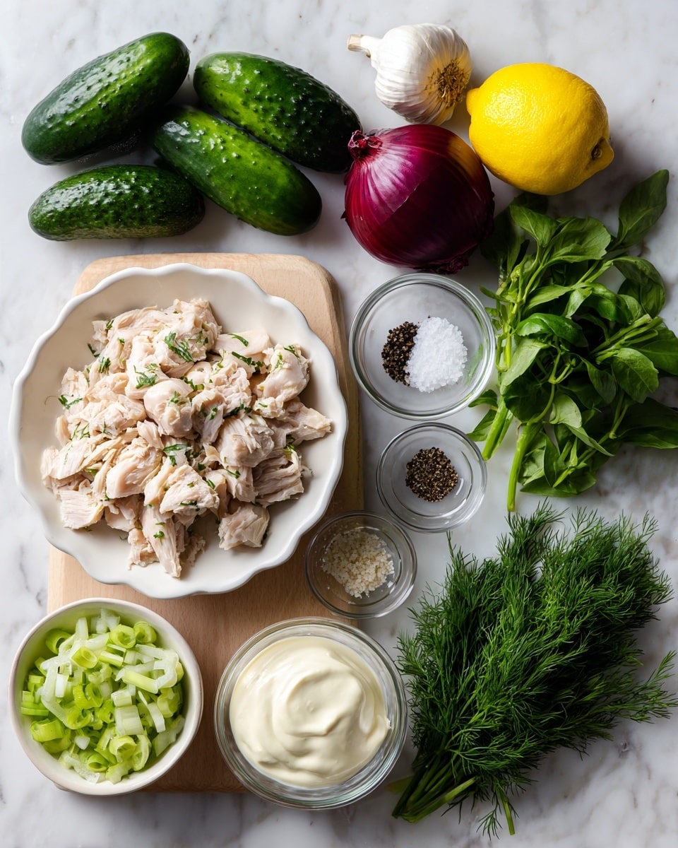 A white scalloped bowl filled with chopped cooked chicken pieces sits on a white marbled surface. Around the bowl are fresh ingredients: three small dark green cucumbers to the left, a bright yellow lemon next to a small white garlic clove, a whole dark purple-red onion, a dark green avocado beside three green scallions. Small clear glass bowls contain white salt and black pepper granules. Near the bottom, a white bowl holds thick white Greek yogurt with a small glass bowl of pale creamy mayonnaise next to it. Fresh green herbs including dark green basil leaves, feathery dill, and chopped parsley form small bunches at the right edge. All ingredients are spread on a light wooden board atop the white marbled surface photo taken with an iphone --ar 4:5 --v 7