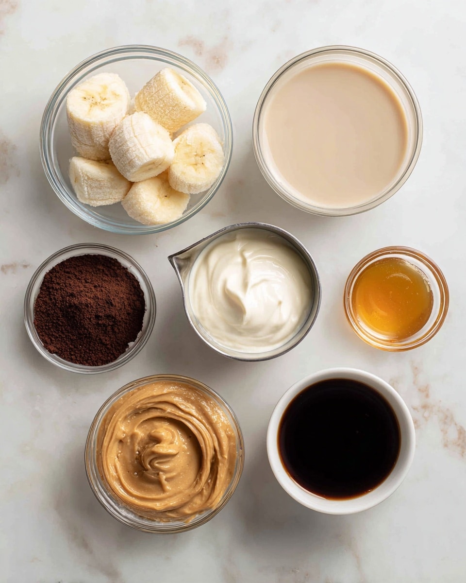 The image shows six clear glass bowls and a metal measuring cup, all placed on a white marbled surface. The top left bowl holds five pieces of frozen banana, pale yellow with a frosty texture. To the right is a bowl filled with vanilla almond milk, smooth and light beige in color. Below the frozen banana, there is a metal measuring cup with thick, creamy vanilla yogurt in white. Next to it, a bowl contains creamy peanut butter in light brown with glossy swirls. Below the peanut butter is a small clear bowl of golden maple or sweetener syrup. On the bottom left, a white bowl holds dry cocoa powder, deep brown and powdery. The last bowl on the bottom right contains strong brewed coffee with a dark almost black liquid inside. Photo taken with an iphone --ar 4:5 --v 7