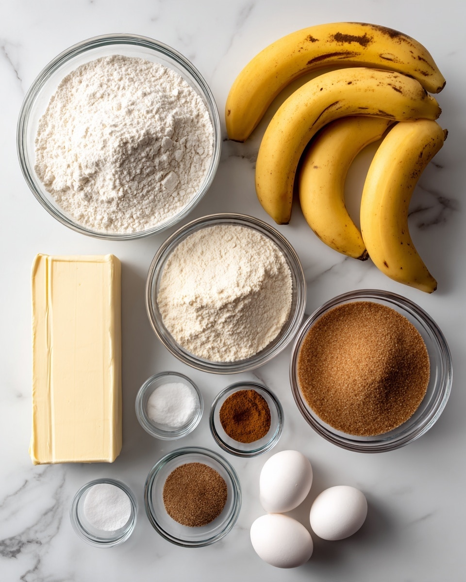 The image shows a white marbled surface with baking ingredients neatly arranged: a large clear bowl with white flour on the top left, three yellow bananas with some brown spots on the top right, a medium clear bowl with light brown flour below the bananas, a medium clear bowl with brown sugar to the bottom right, two whole white eggs placed side by side near the center, a small clear bowl with two brown spices near the bottom left, a small clear bowl with white baking soda below the spice bowl, and a rectangular stick of butter on the left side next to the flour bowl, all placed separately and cleanly. photo taken with an iphone --ar 4:5 --v 7